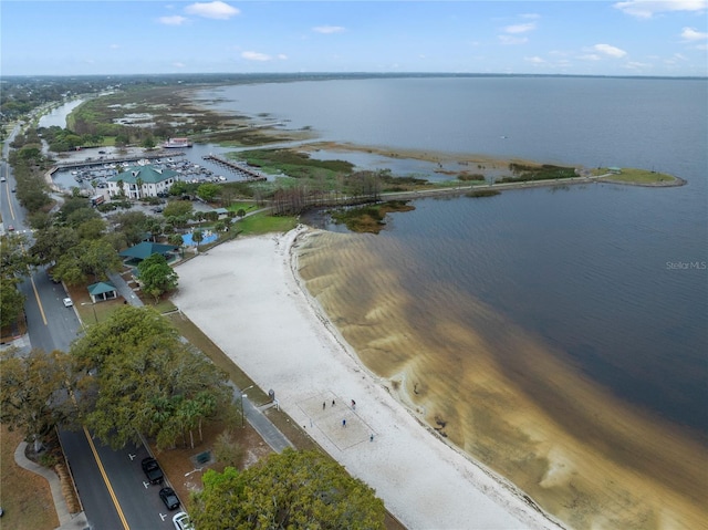 birds eye view of property featuring a water view and a view of the beach