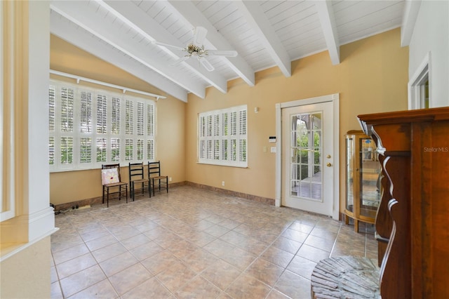 entryway featuring baseboards, a ceiling fan, wood ceiling, vaulted ceiling with beams, and light tile patterned flooring