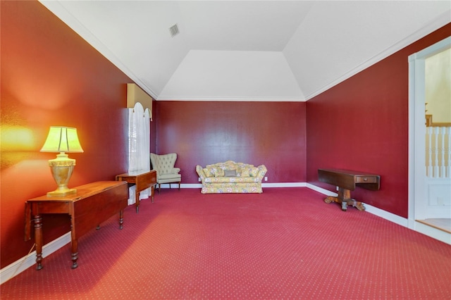 living area featuring carpet floors, visible vents, vaulted ceiling, and baseboards