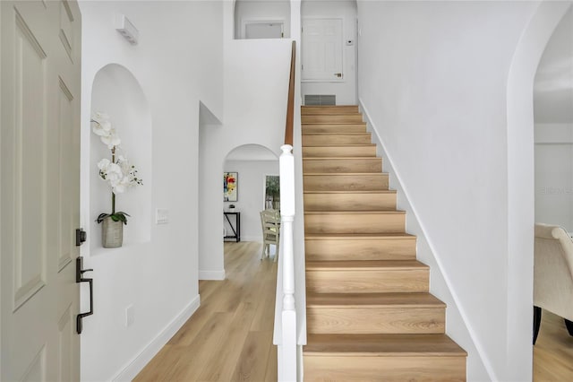 stairway featuring hardwood / wood-style flooring