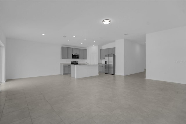 unfurnished living room featuring light tile patterned flooring