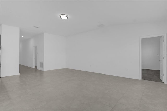 empty room with light tile patterned floors