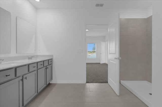 bathroom featuring dual vanity and tile patterned floors