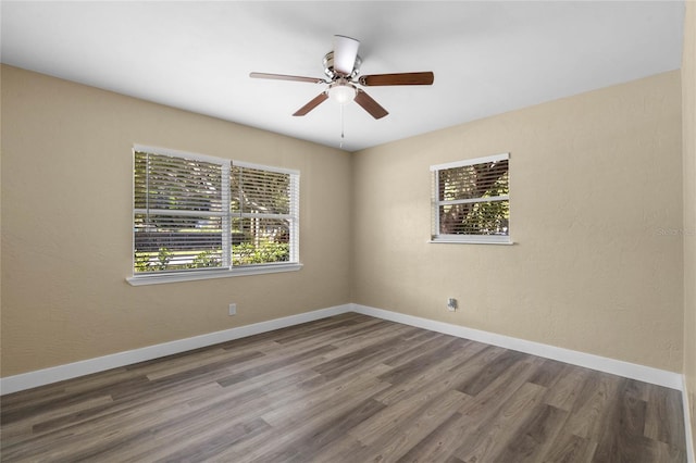 unfurnished room with hardwood / wood-style floors and ceiling fan