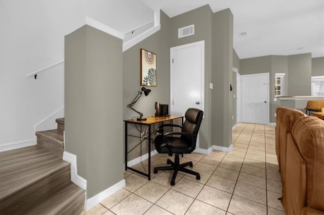 office space with light tile patterned floors