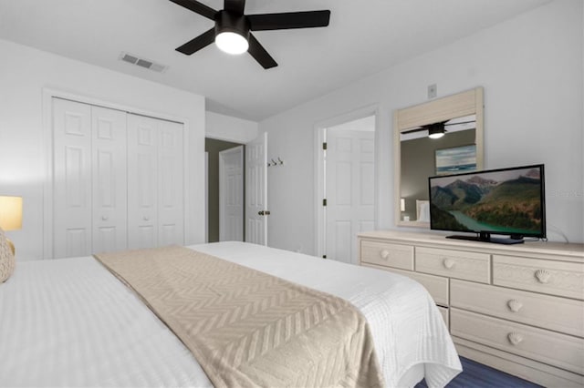 bedroom featuring ceiling fan and a closet