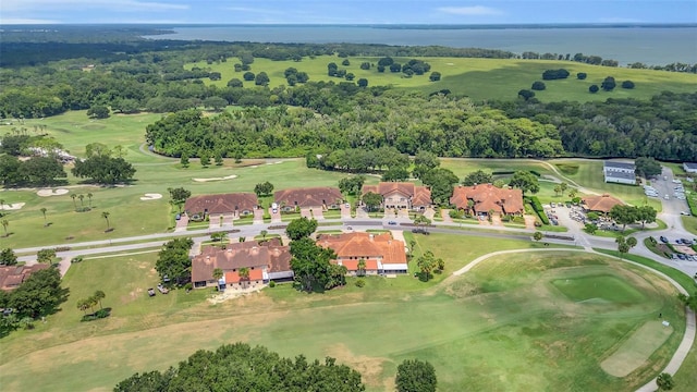 aerial view with a water view and view of golf course