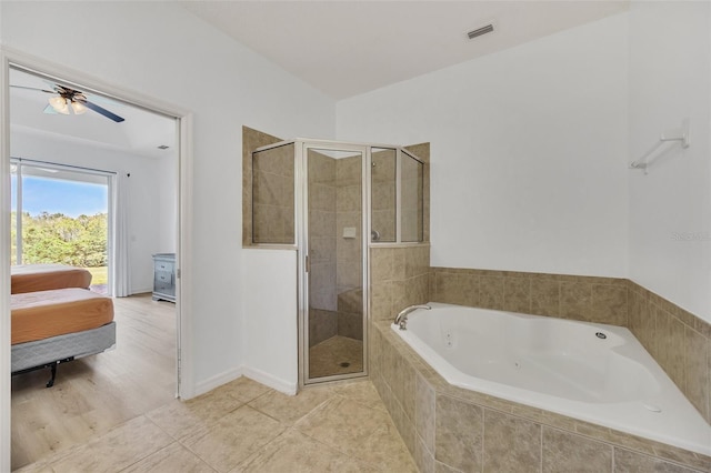 bathroom with ceiling fan, plus walk in shower, and hardwood / wood-style floors