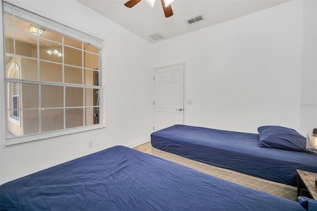 bedroom featuring ceiling fan and hardwood / wood-style floors