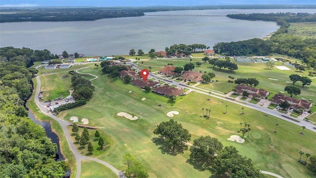 birds eye view of property featuring a water view and view of golf course