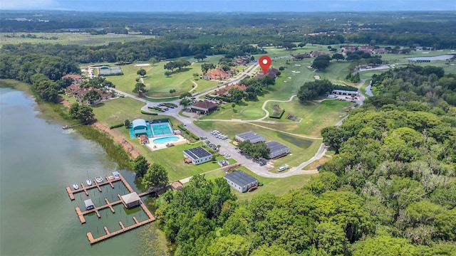 aerial view with a water view and a wooded view