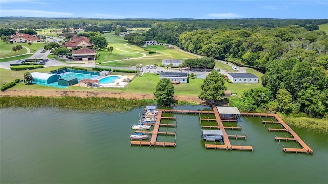 drone / aerial view featuring a water view and a view of trees