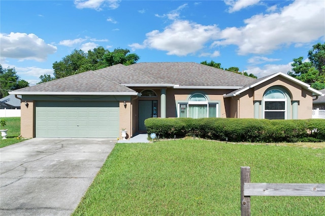 single story home with a front lawn and a garage