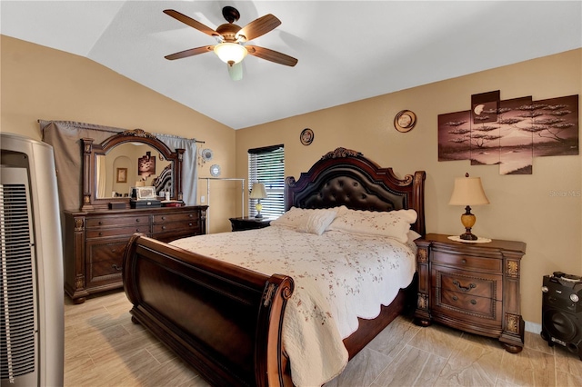 bedroom featuring ceiling fan and lofted ceiling