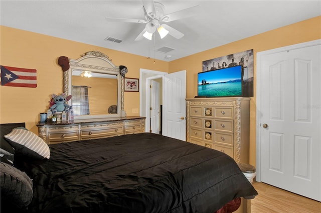 bedroom featuring ceiling fan and light hardwood / wood-style floors