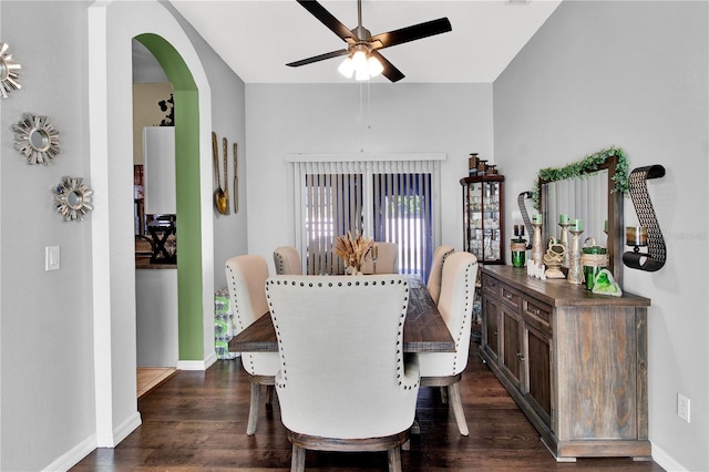 dining area with ceiling fan and dark hardwood / wood-style flooring