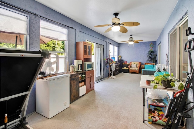 interior space featuring ceiling fan