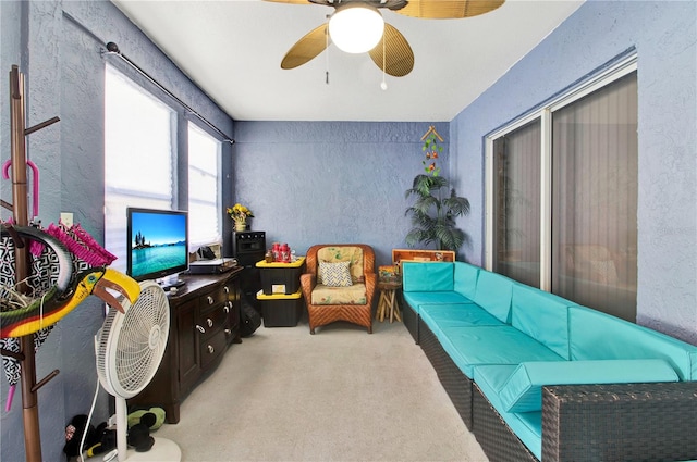 living room with ceiling fan and light carpet