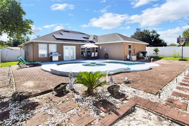 view of pool featuring area for grilling, french doors, and a patio area