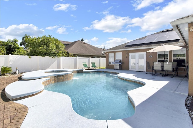 view of swimming pool with an in ground hot tub, french doors, a grill, and a patio area