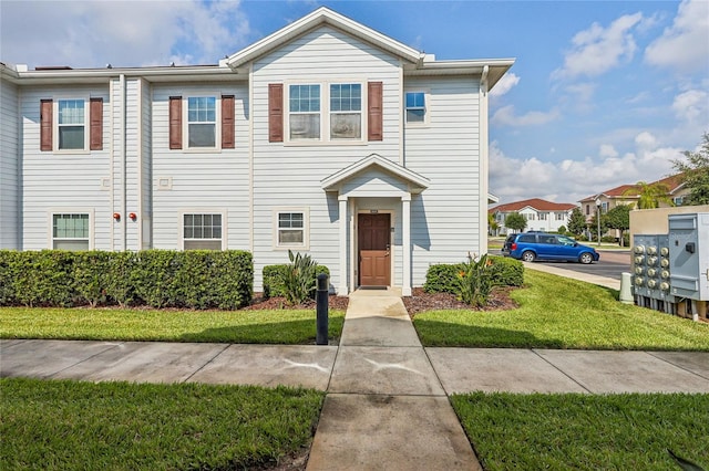 view of front of home featuring a front lawn