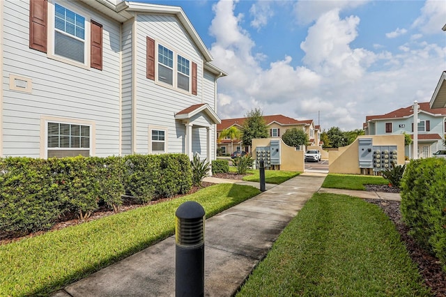 view of community featuring a yard