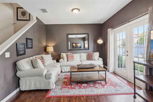 living room featuring plenty of natural light and hardwood / wood-style flooring