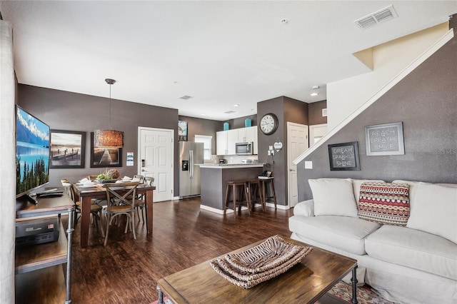 living room featuring dark hardwood / wood-style flooring