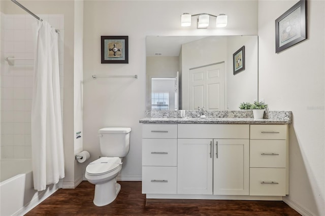 full bathroom featuring shower / tub combo with curtain, toilet, vanity, and hardwood / wood-style flooring