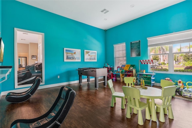 recreation room with wood-type flooring