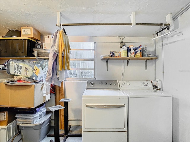 clothes washing area with washer and dryer