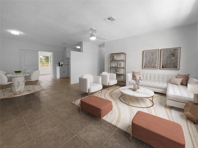 living room with ceiling fan and dark tile patterned floors