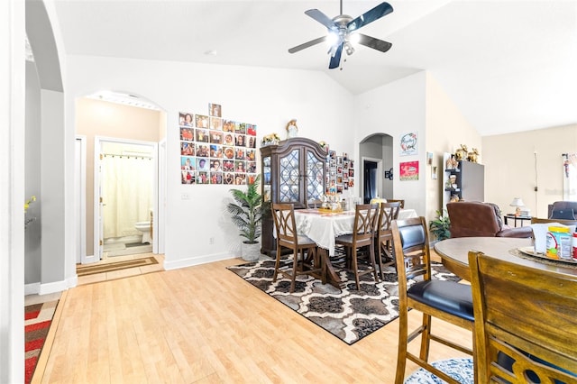 dining area featuring ceiling fan, light hardwood / wood-style flooring, and vaulted ceiling