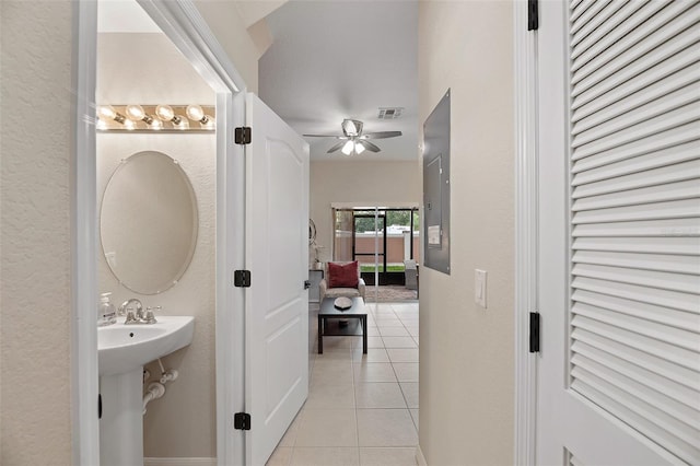 bathroom featuring ceiling fan and tile patterned floors