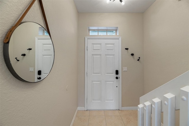 foyer featuring light tile patterned floors