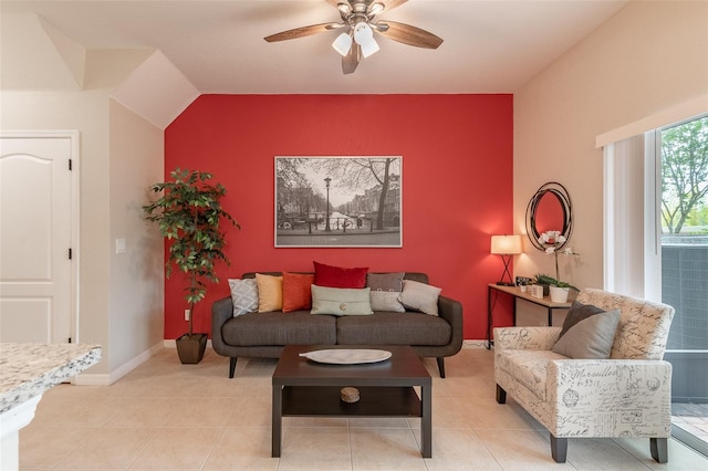 living room featuring ceiling fan and light tile patterned floors