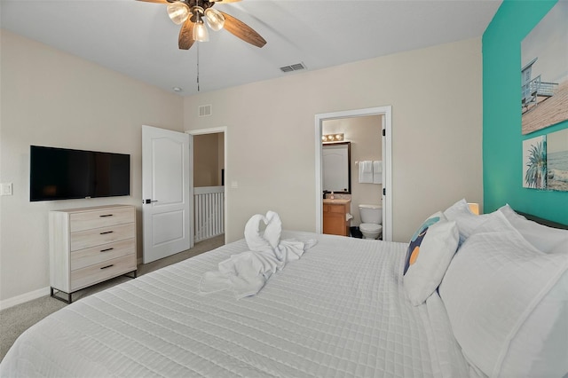 bedroom featuring connected bathroom, ceiling fan, and carpet