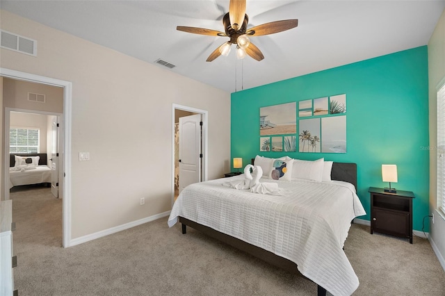 carpeted bedroom featuring ceiling fan