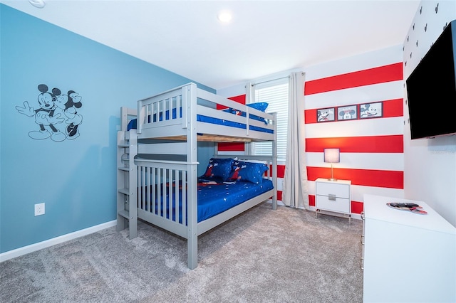 bedroom with carpet floors and baseboards