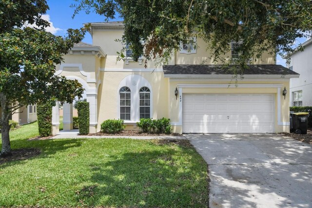 view of front of house featuring a garage and a front yard