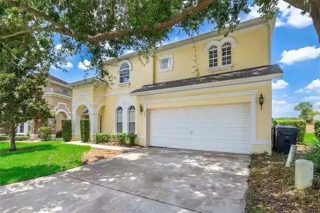 mediterranean / spanish-style house with a garage