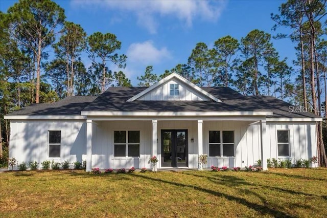 view of front of property with a front yard and covered porch