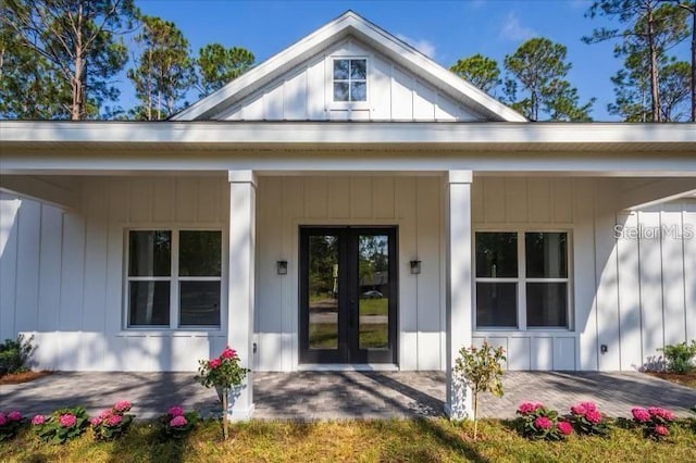 view of exterior entry featuring french doors