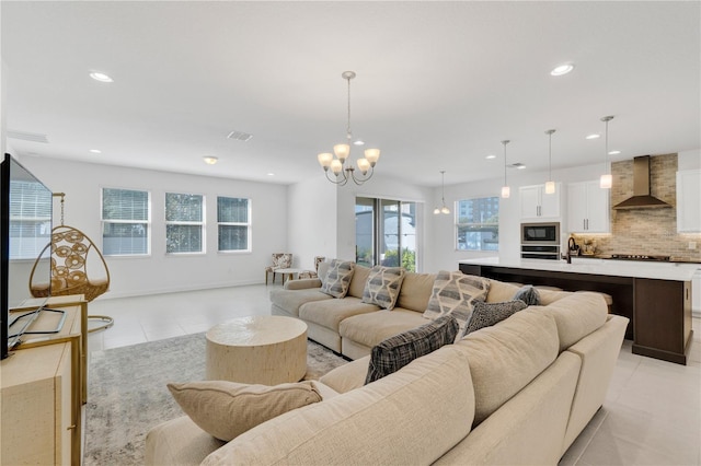 living room featuring an inviting chandelier and light tile patterned floors