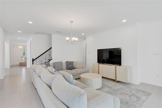 tiled living room featuring a chandelier