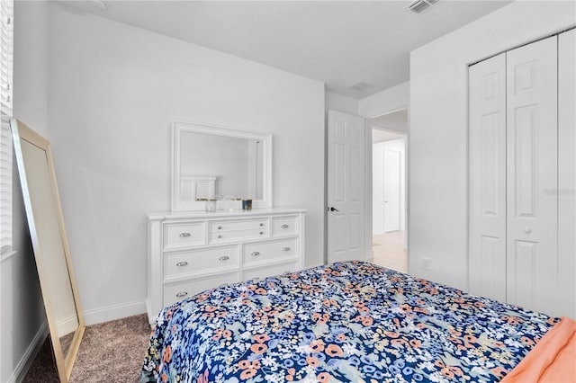 carpeted bedroom with a closet