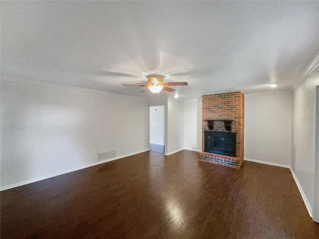 unfurnished living room featuring ceiling fan, a textured ceiling, visible vents, baseboards, and a brick fireplace