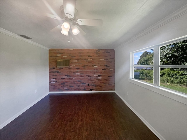 additional living space featuring dark wood-style floors, brick wall, baseboards, and a ceiling fan