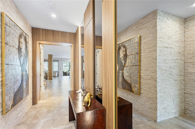 corridor featuring light tile patterned floors