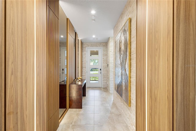 corridor featuring light tile patterned flooring